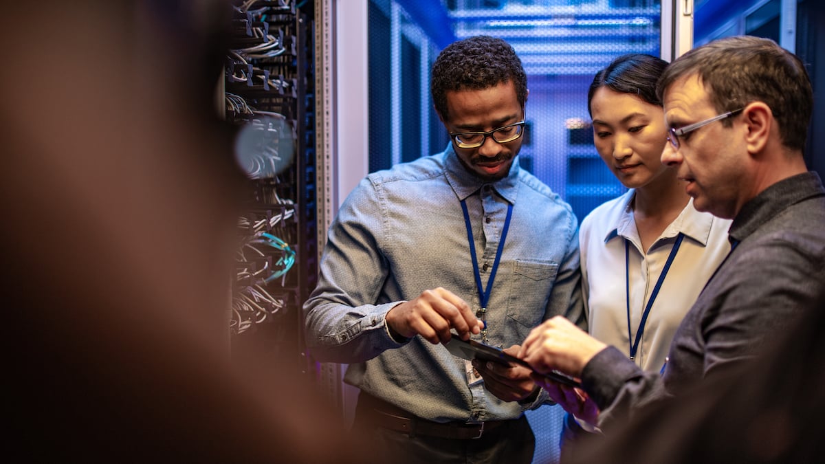 Coworkers assessing a security incident in the server room
