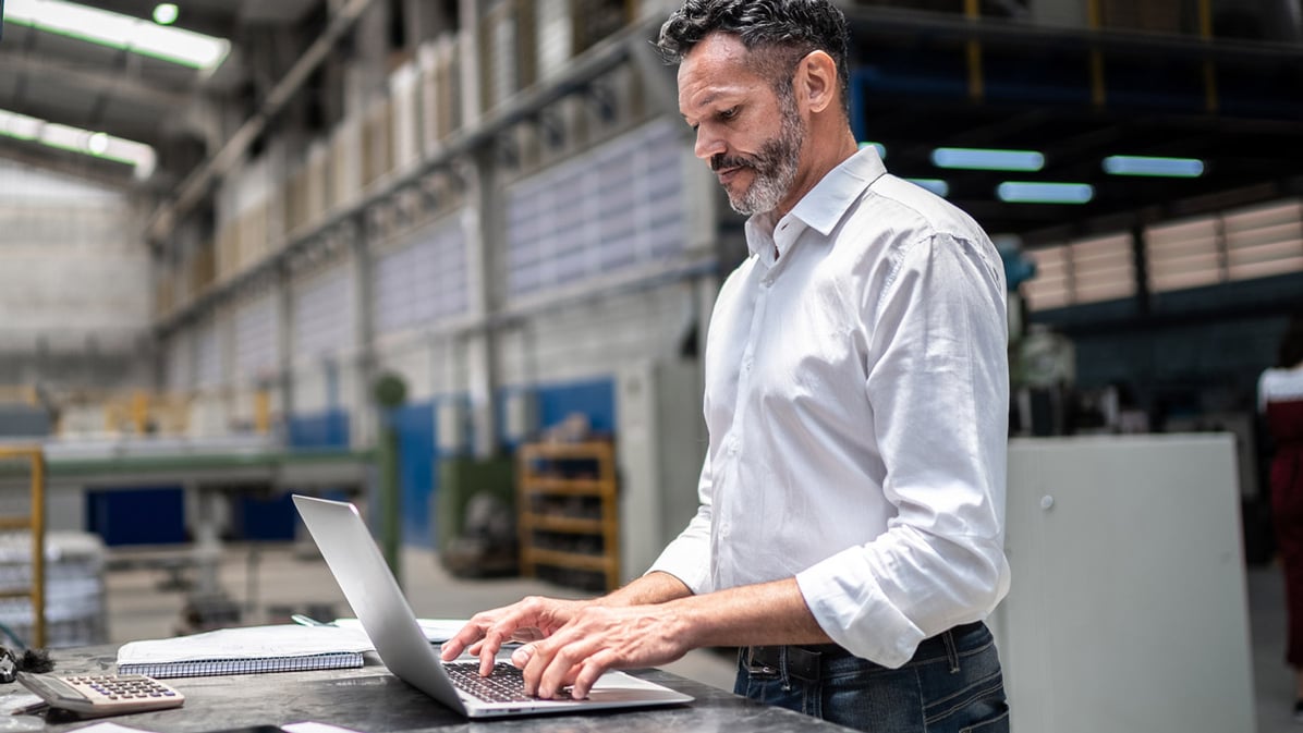 factory-supervisor-working-over-laptop.jpg