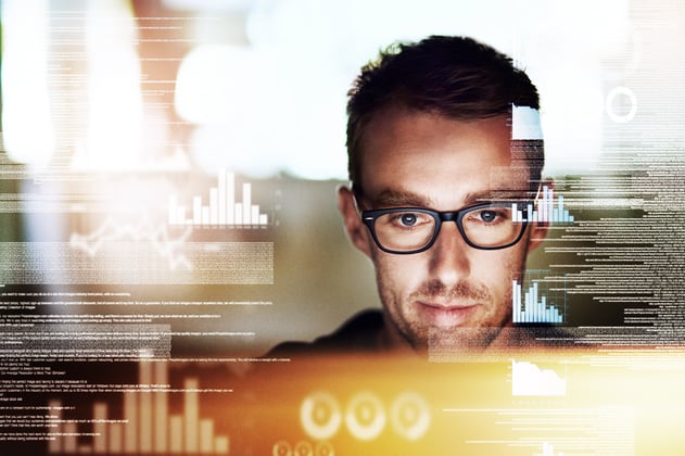 Man in glasses working in cloud computing environment