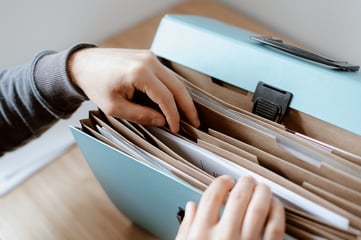 Person going through paper files
