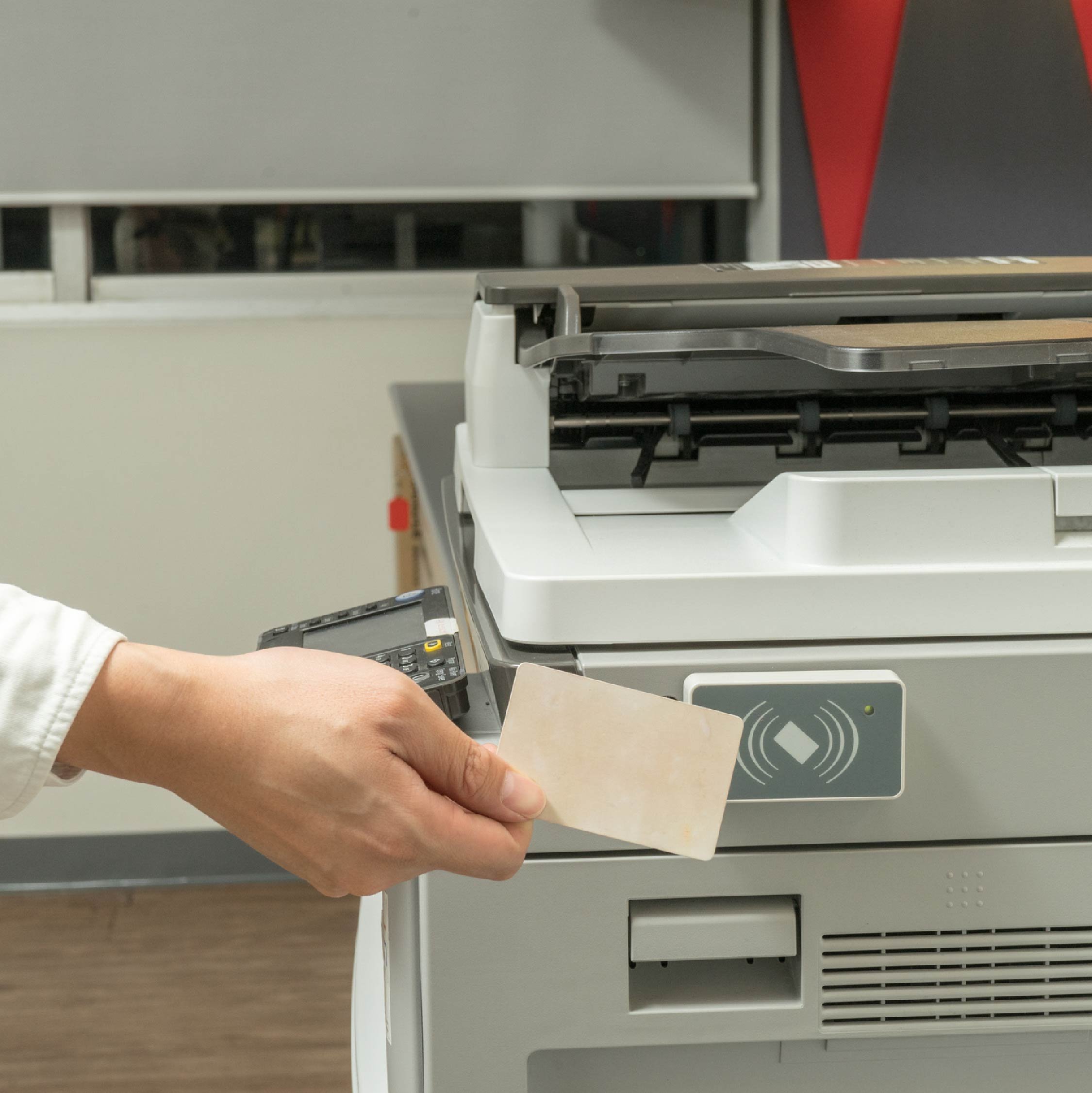 swiping-badge-at-printer